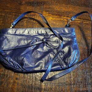 Vintage purple crossbody purse with a bow